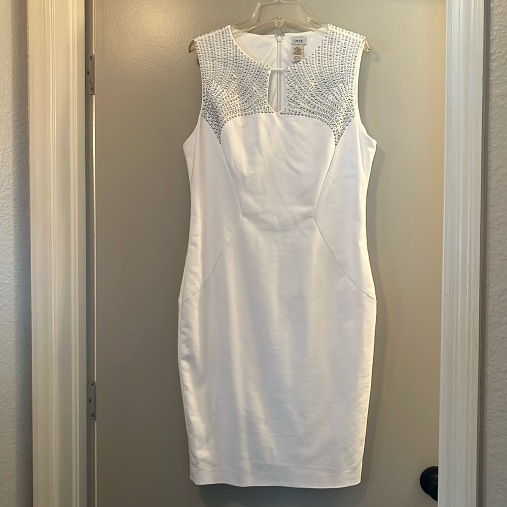 Hardly worn perfect condition white sleeveless sheath dress. to knee. No flaws